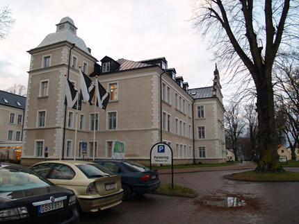 Vadstena library, parked cars, single tree